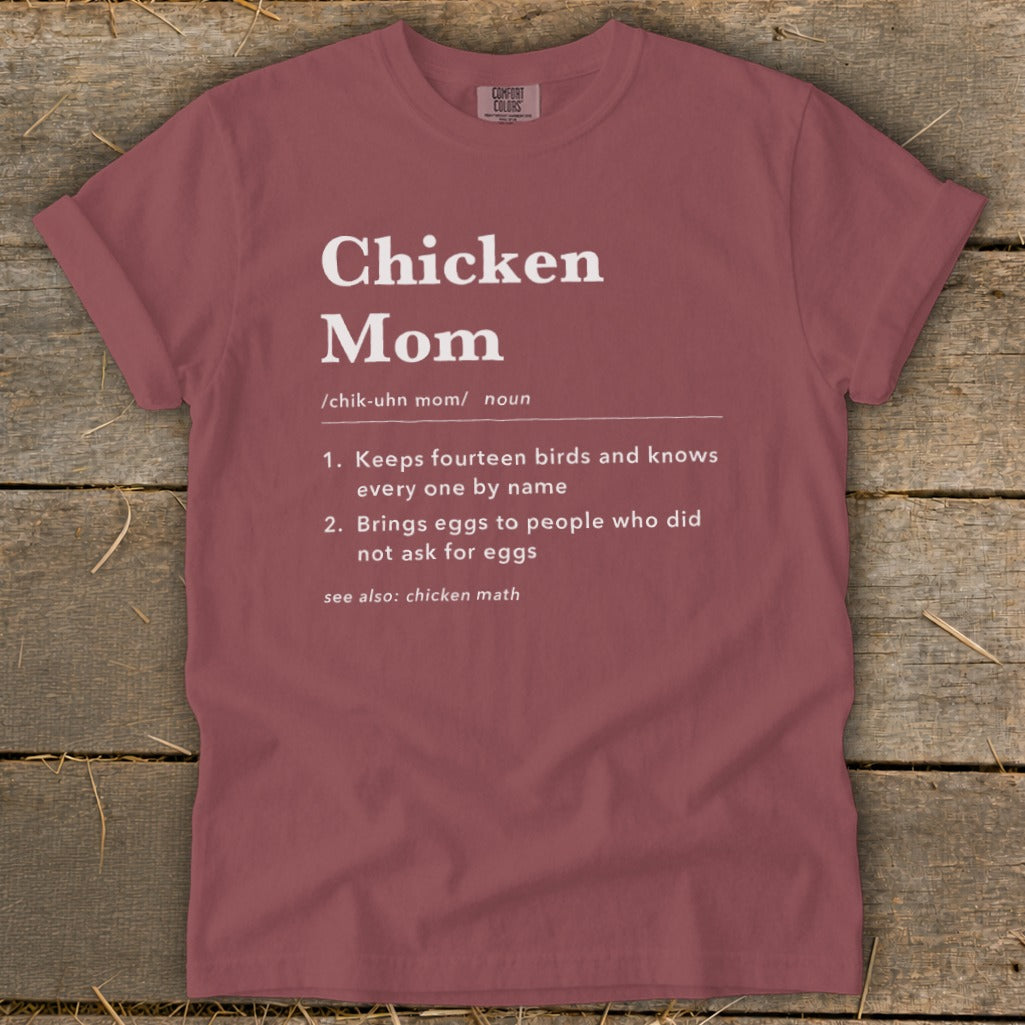 Maroon t-shirt with "Chicken Mom" definition: Keeps fourteen birds, brings eggs, see chicken math.