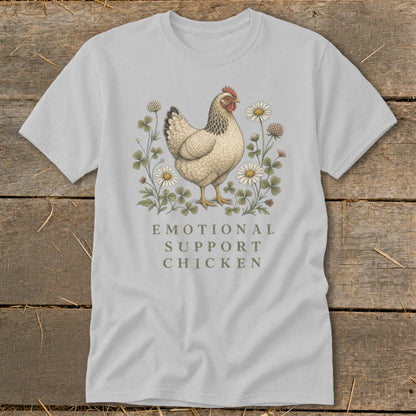 Light gray t-shirt with an illustration of a chicken among flowers and text.