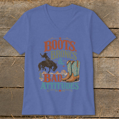 T-shirt with "Boots, Broncs & Bad Attitudes" text, cowboy, and boots graphic.