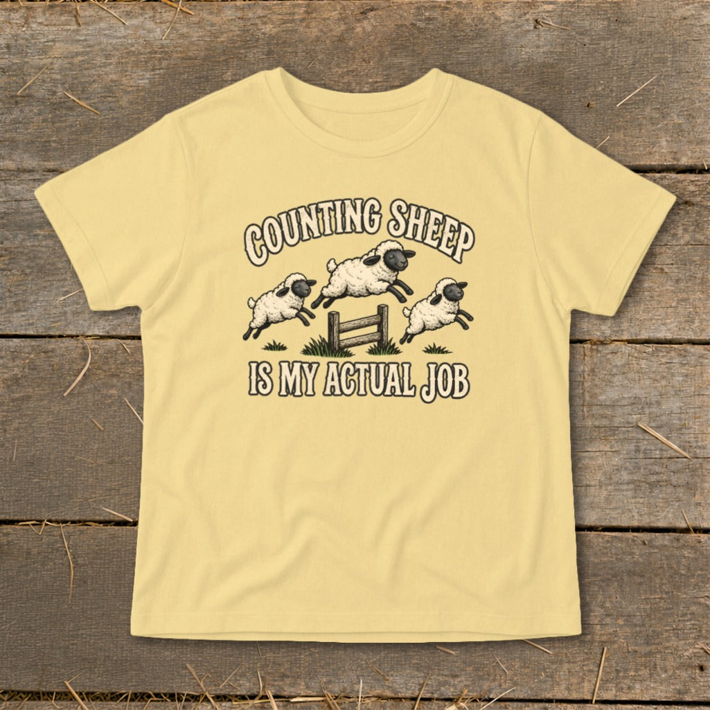 Yellow t-shirt with "Counting Sheep Is My Actual Job" and jumping sheep graphic.