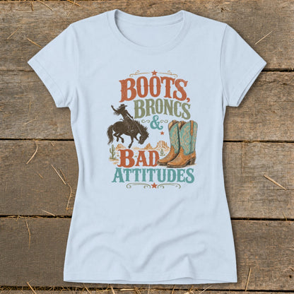 Light blue t-shirt with "Boots, Broncs & Bad Attitudes" graphic.