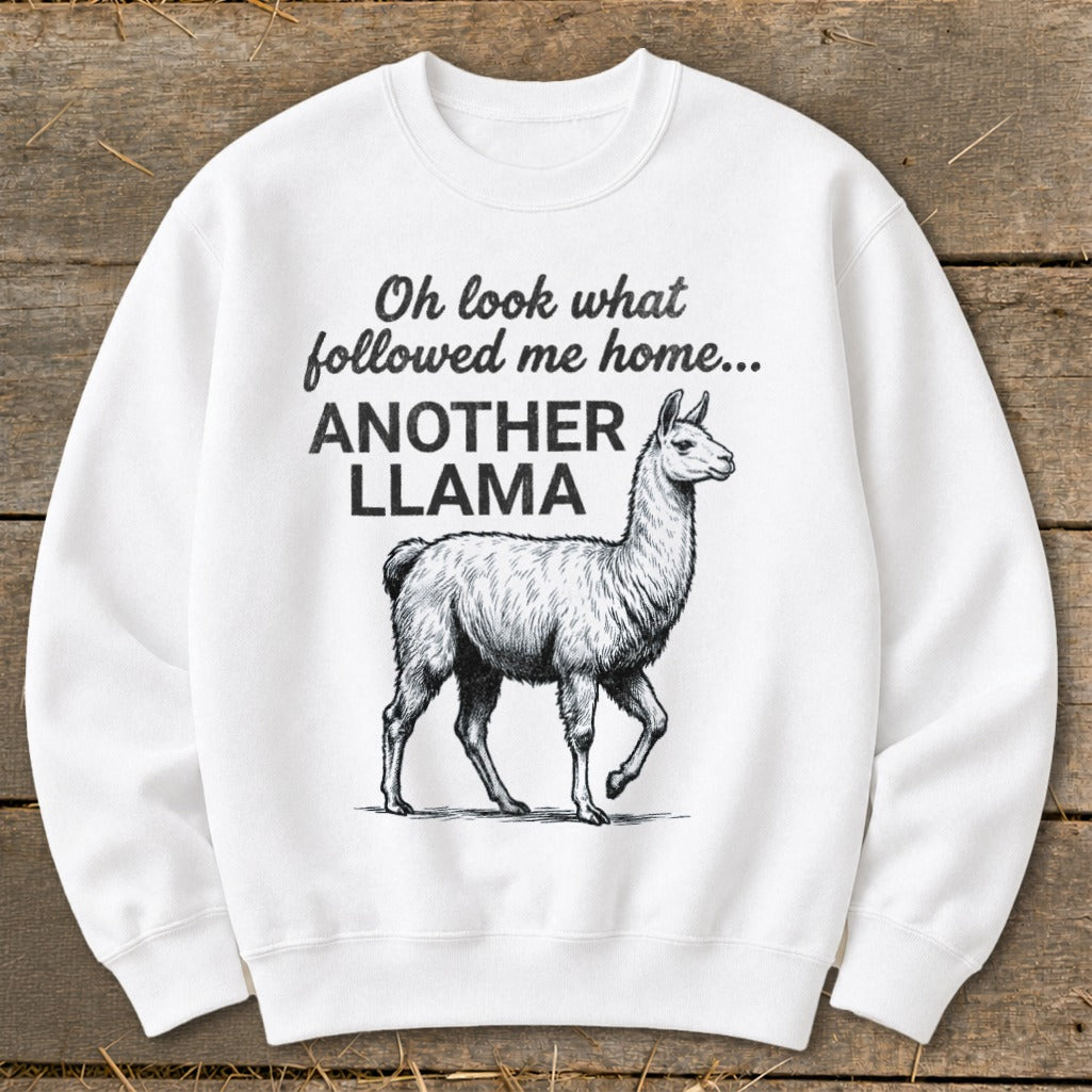 White sweatshirt with sketch of llama and text "Oh look what followed me home... ANOTHER LLAMA".