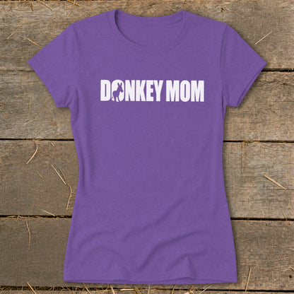 Purple women’s t-shirt featuring the white text DONKEY MOM with a donkey silhouette inside the letter O.