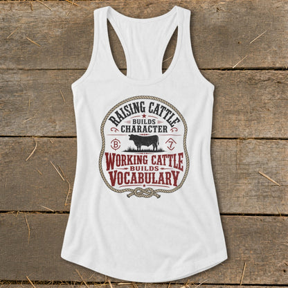 White tank top with "Raising Cattle Builds Character, Working Cattle Builds Vocabulary" text and cow graphic.