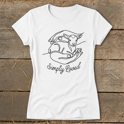 White t-shirt with a line drawing of hands cradling a lamb and text "Simply Loved".