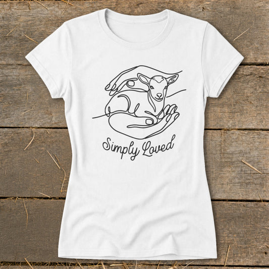 White t-shirt with a line drawing of hands cradling a lamb and text "Simply Loved".