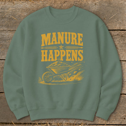 Green sweatshirt with yellow graphic of a wheelbarrow full of manure and text "MANURE HAPPENS".