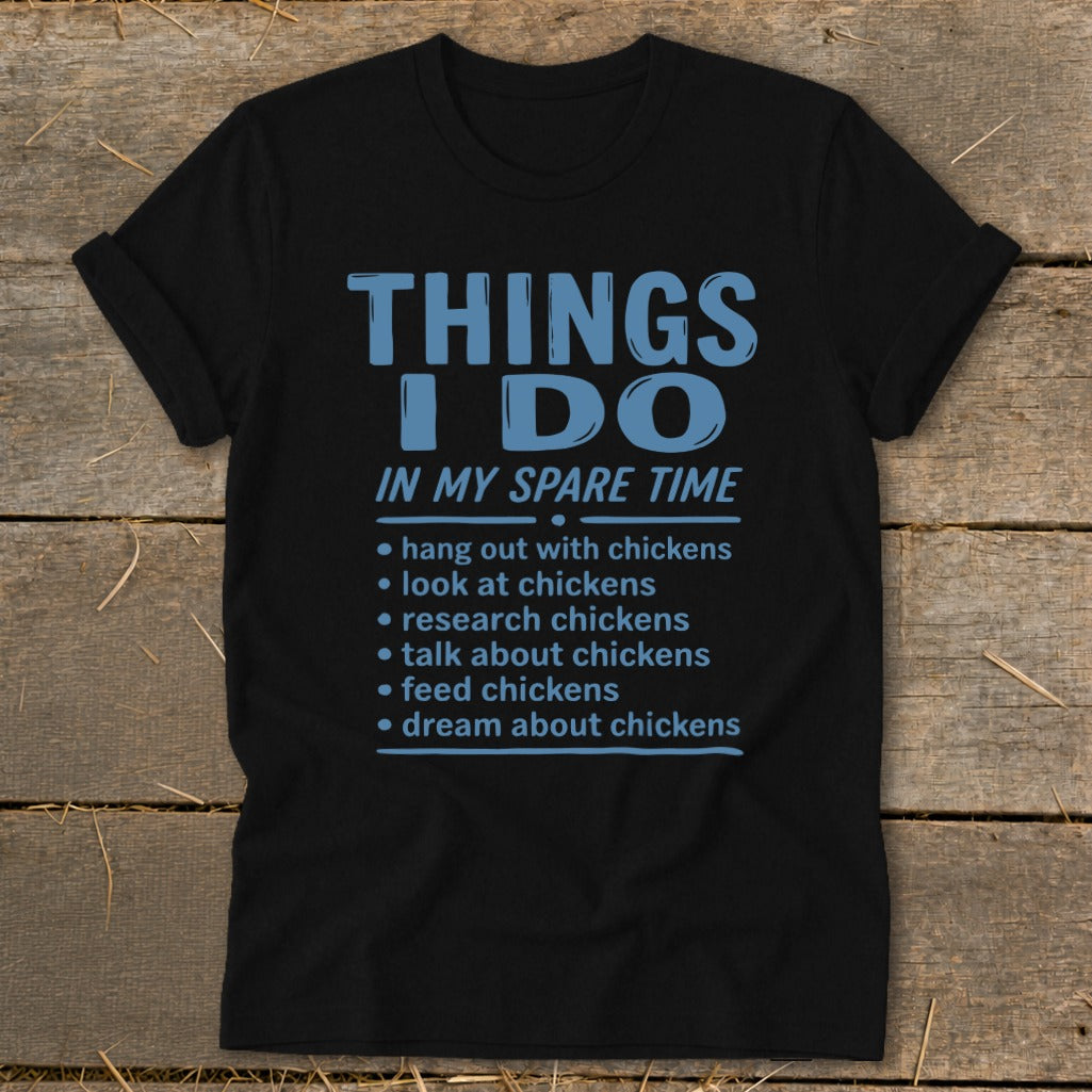 Black t-shirt with text listing chicken-related activities for spare time.
