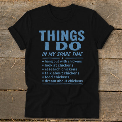 Black t-shirt with text listing chicken-related activities for spare time.