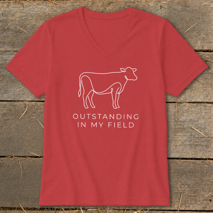 Red t-shirt with white cow outline and text "OUTSTANDING IN MY FIELD".