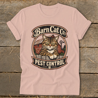Pink crewneck t-shirt featuring a circular graphic of a tabby cat and text reading Barn Cat Co. Pest Control.
