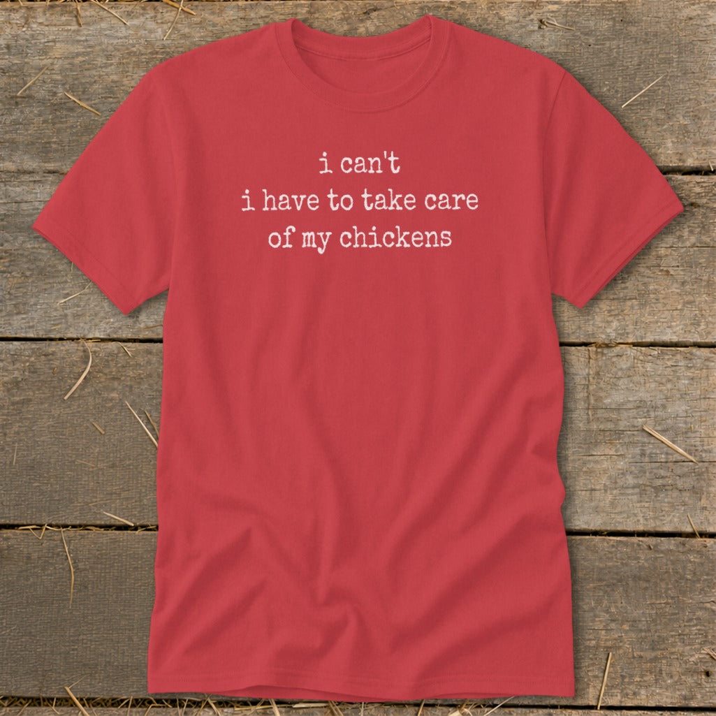 Red t-shirt with white text that reads "i can't i have to take care of my chickens".
