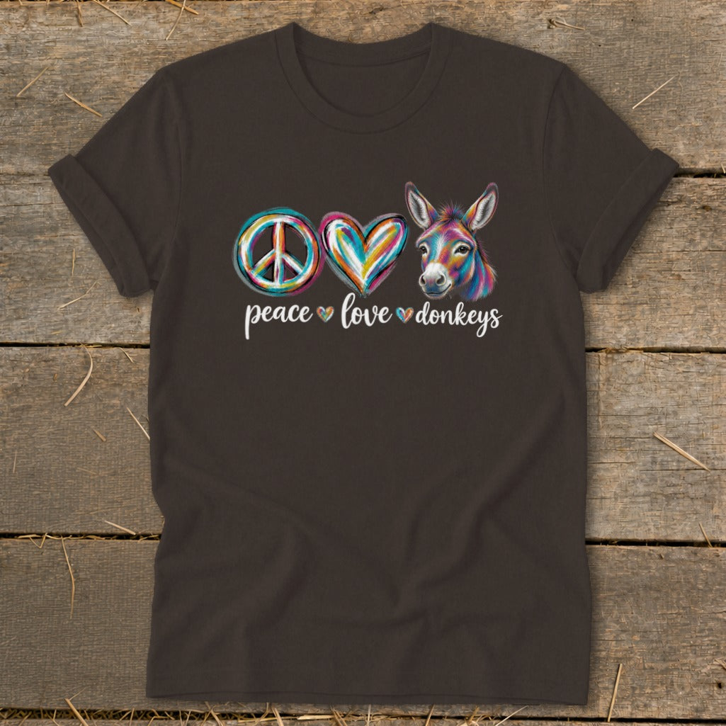 Dark t-shirt with peace sign, heart, and donkey graphic and "peace love donkeys" text.