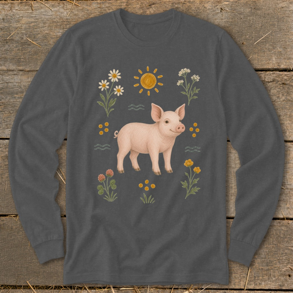 Long sleeve shirt with a pink pig surrounded by flowers and a sun graphic.