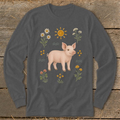 Long sleeve shirt with a pink pig surrounded by flowers and a sun graphic.