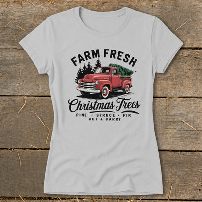 Light grey t-shirt with vintage red truck loaded with Christmas trees and "Farm Fresh Christmas Trees" text.