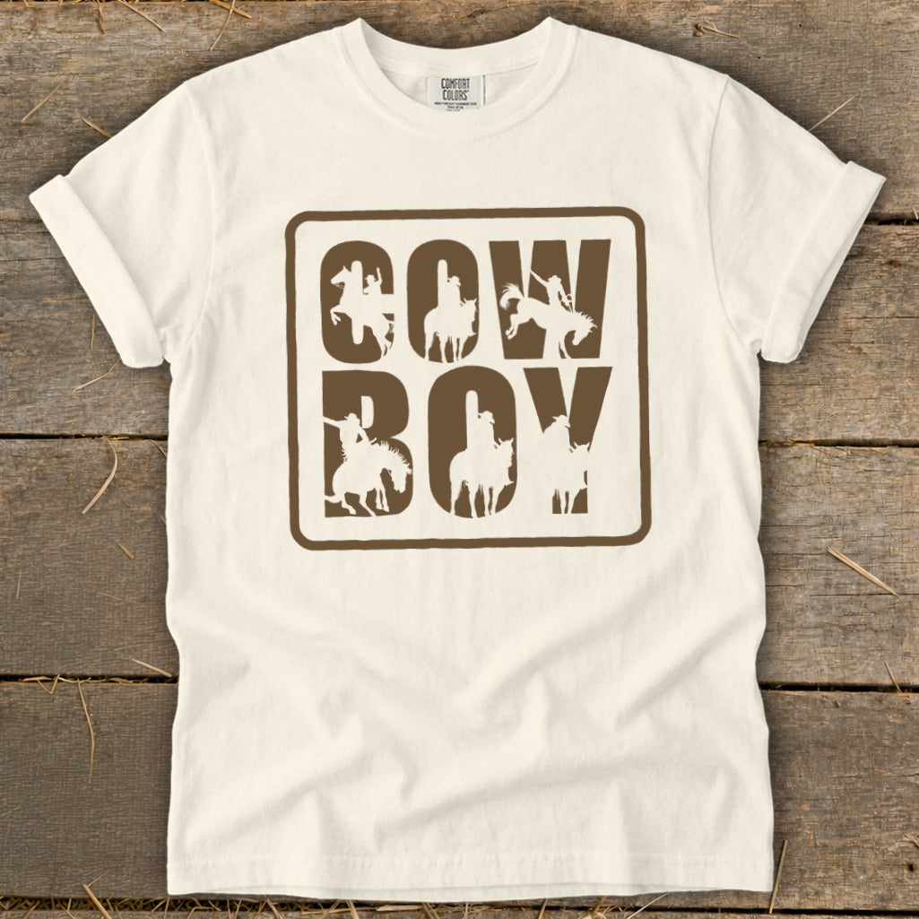 White t-shirt with brown "COWBOY" text and horse silhouettes.