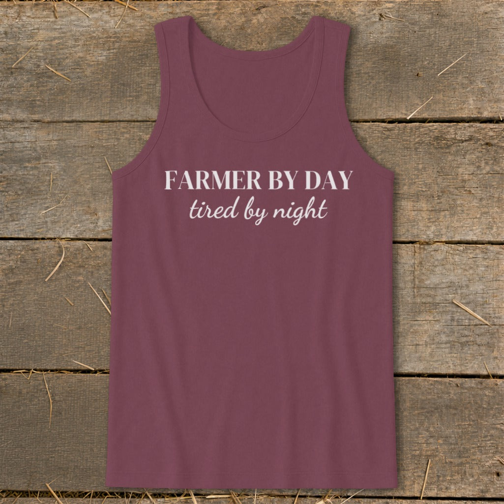 Maroon tank top with white text "FARMER BY DAY tired by night".