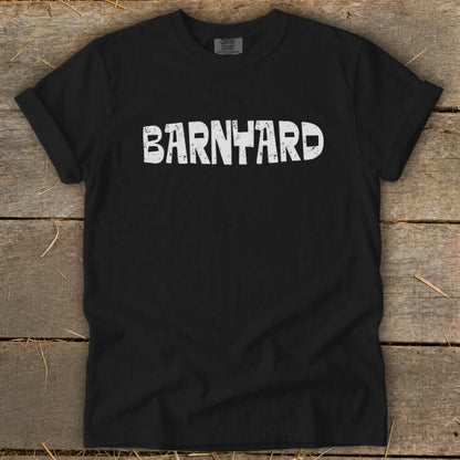 Black t-shirt with rolled sleeves displaying the distressed white text BARNYARD centered on the chest.