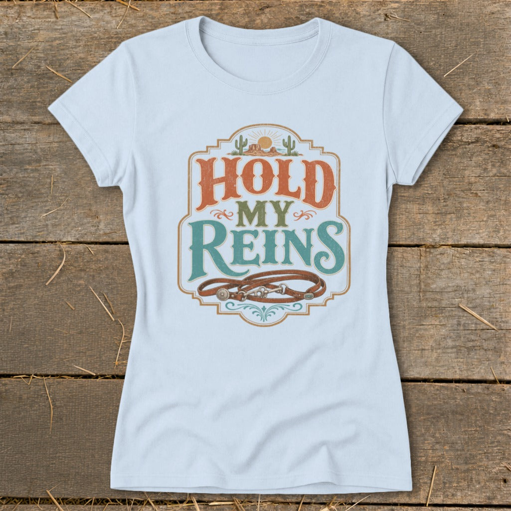 Light blue t-shirt with "Hold My Reins" text and horse reins graphic.