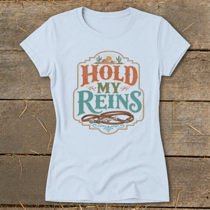 Light blue t-shirt with "Hold My Reins" text and horse reins graphic.
