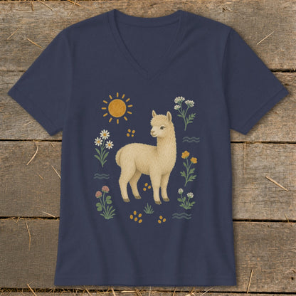 T-shirt with cream alpaca surrounded by flowers, sun, and waves.