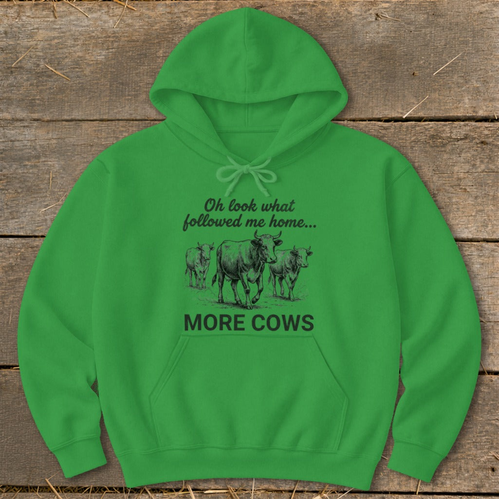 Green hoodie with "Oh look what followed me home... MORE COWS" and a drawing of cows.