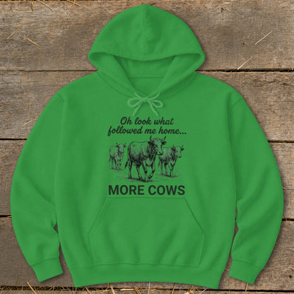 Green hoodie with "Oh look what followed me home... MORE COWS" and a drawing of cows.