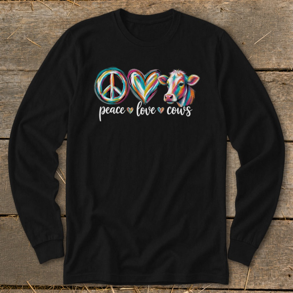 Long sleeve shirt with peace, love, and a cow graphic and text.