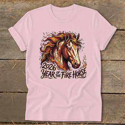 Pink t-shirt with graphic of a fiery horse head and text "2026 Year of the Fire Horse".