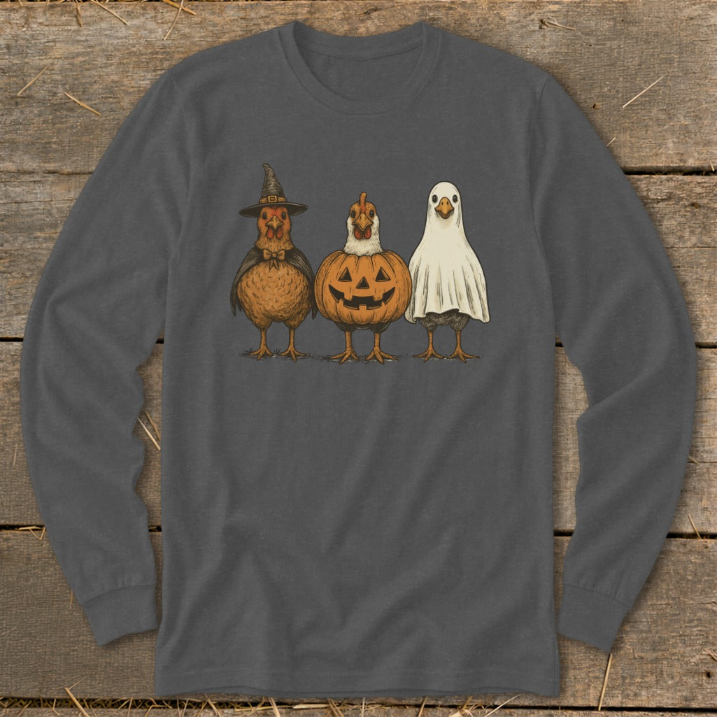 Three chickens in Halloween costumes: witch, jack-o'-lantern, and ghost.