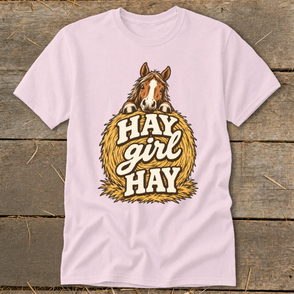 Pink t-shirt with horse illustration and "Hay girl hay" text on hay bale.