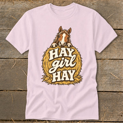 Pink t-shirt with horse illustration and "Hay girl hay" text on hay bale.