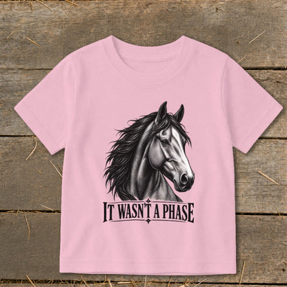 Pink t-shirt with black and white horse graphic and text "IT WASN'T A PHASE".