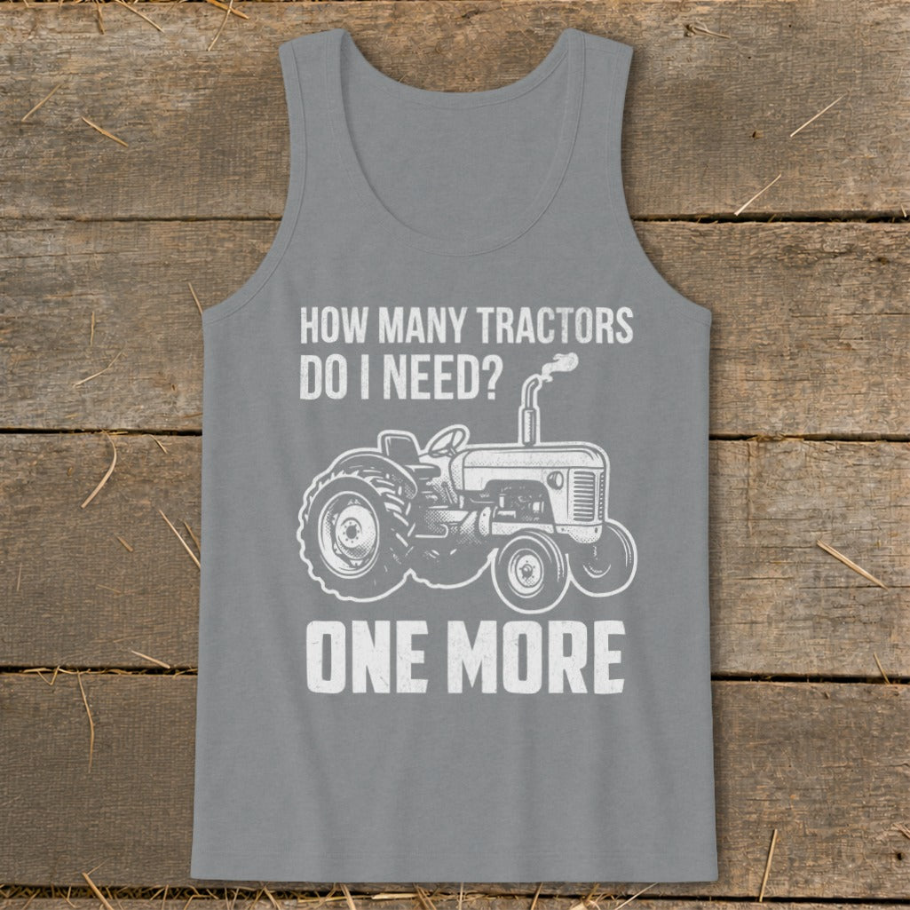 Grey tank top with white text and tractor graphic: "How Many Tractors Do I Need? One More"