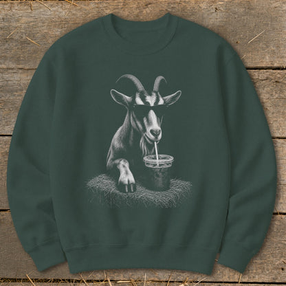 Goat wearing sunglasses drinks from a cup with a straw, depicted on a dark green sweatshirt.