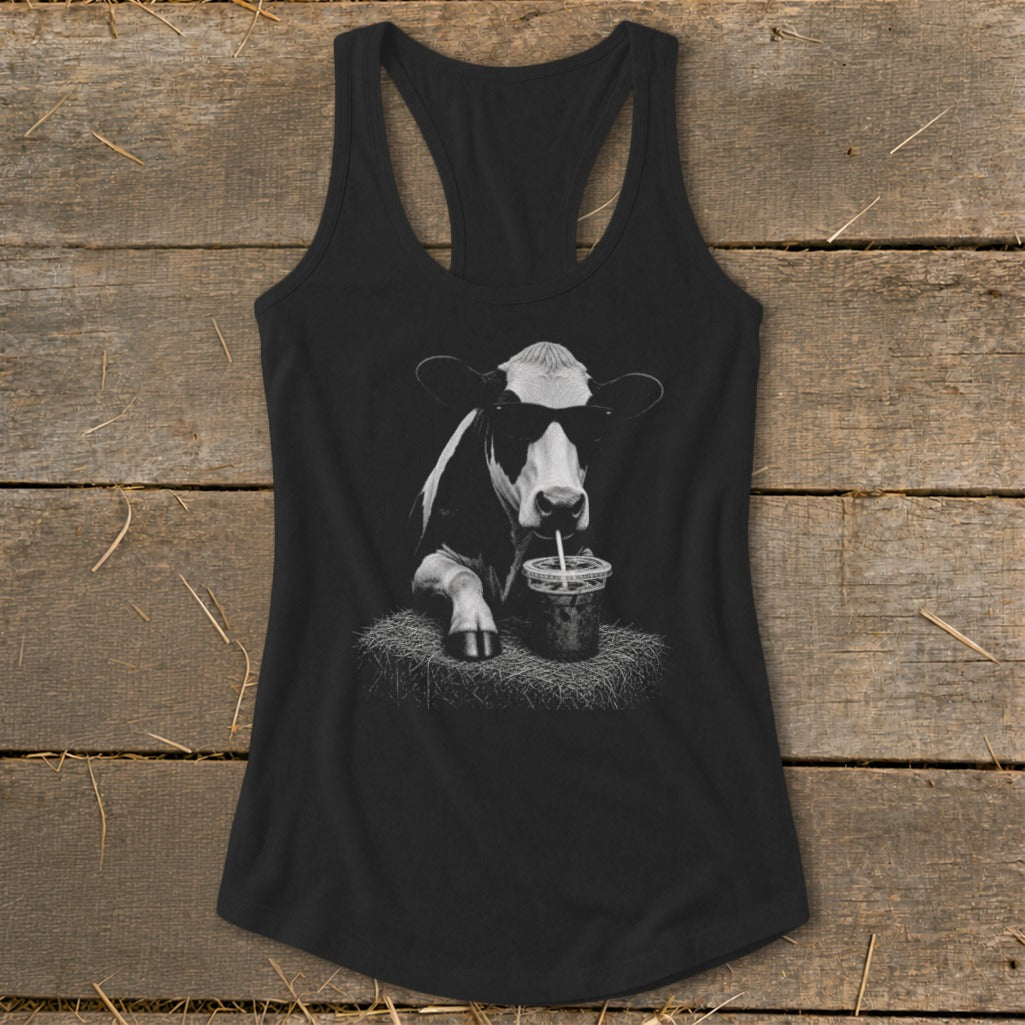 Black tank top with a graphic of a cow wearing sunglasses and drinking from a cup.