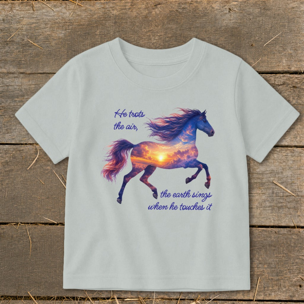 A light gray short-sleeve t-shirt featuring a running horse graphic filled with a sunset sky and inspirational text.