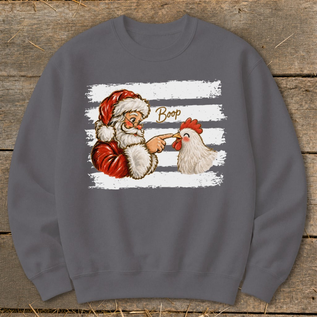 Santa boops a chicken with the word "Boop" written between them.