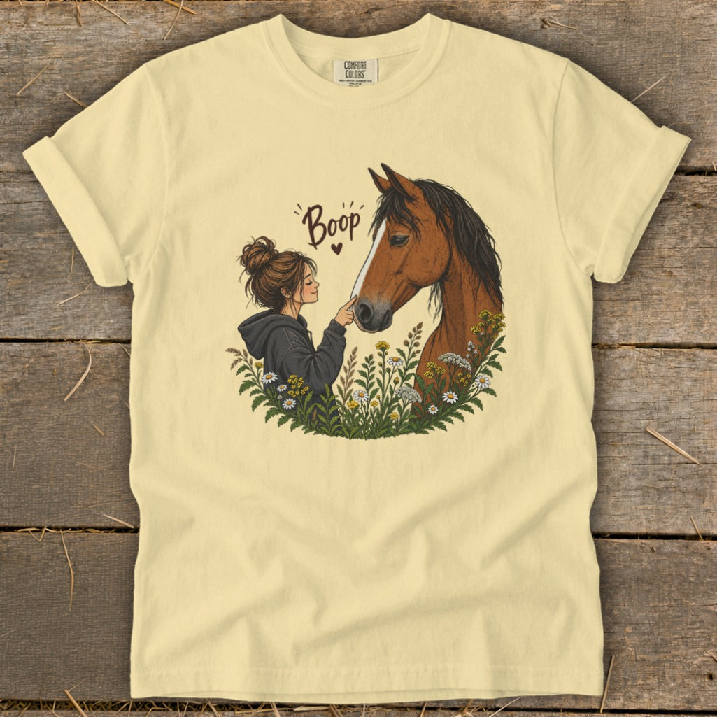 Girl touches horse nose with flower art and "Boop" text.