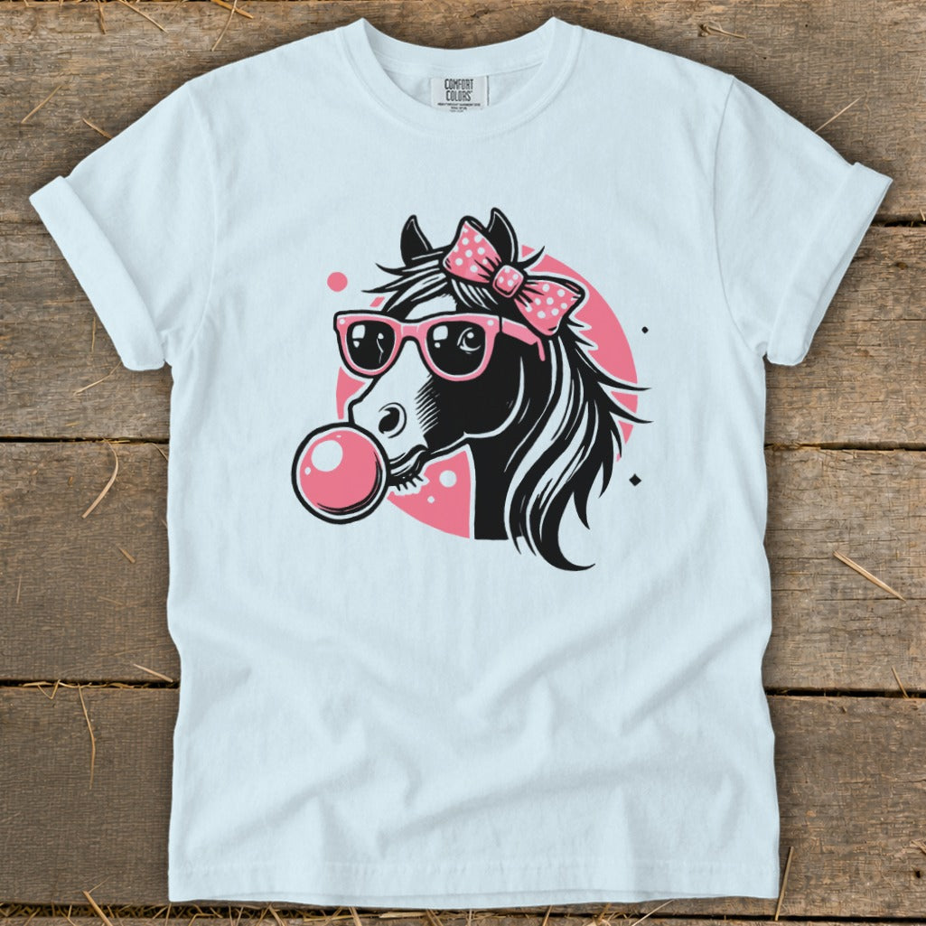 Graphic of a black horse wearing pink sunglasses and a pink bow, blowing pink bubblegum.