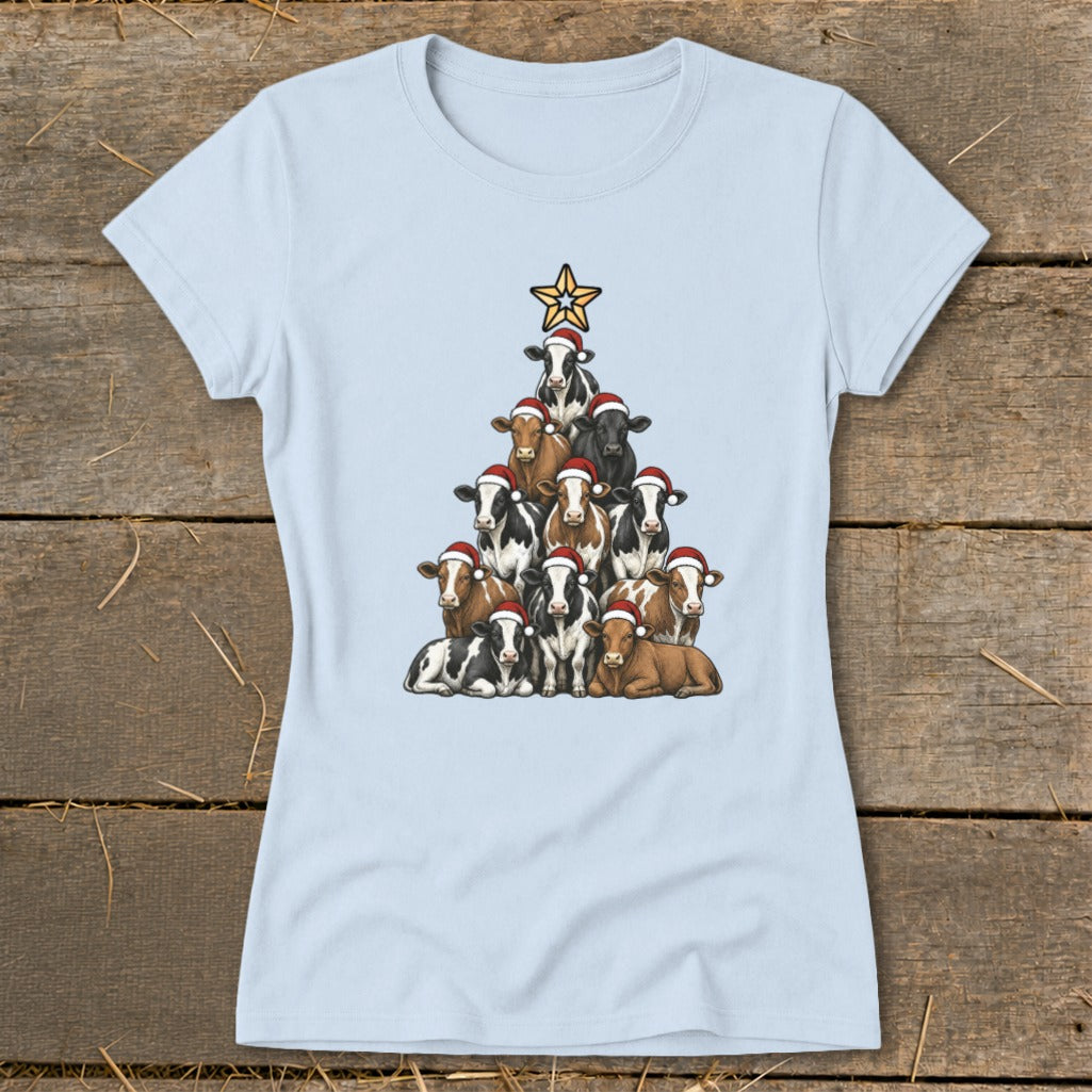 Light blue t-shirt with a Christmas tree made of cows wearing Santa hats and a star.