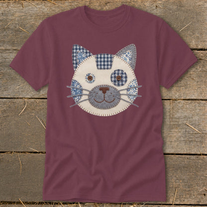 Maroon t-shirt with a quilted cat face applique on the front.