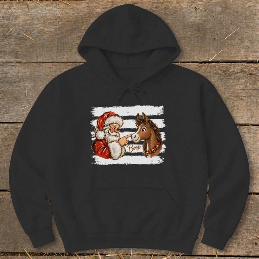 Santa boops a horse on the nose with the word "Boop" written on the horse.