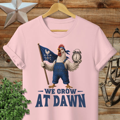 Chicken in overalls holding flag and alarm clock, "We Grow at Dawn" text.