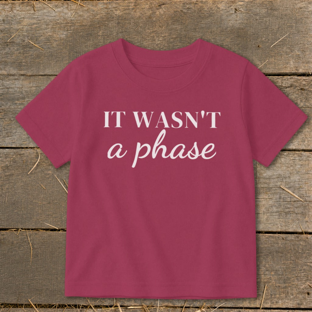 Crimson t-shirt with white text that reads "IT WASN'T a phase".