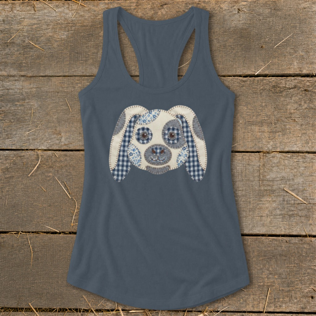 Blue tank top with a stitched dog face applique featuring checkered and floral fabrics.