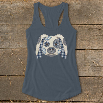 Blue tank top with a stitched dog face applique featuring checkered and floral fabrics.