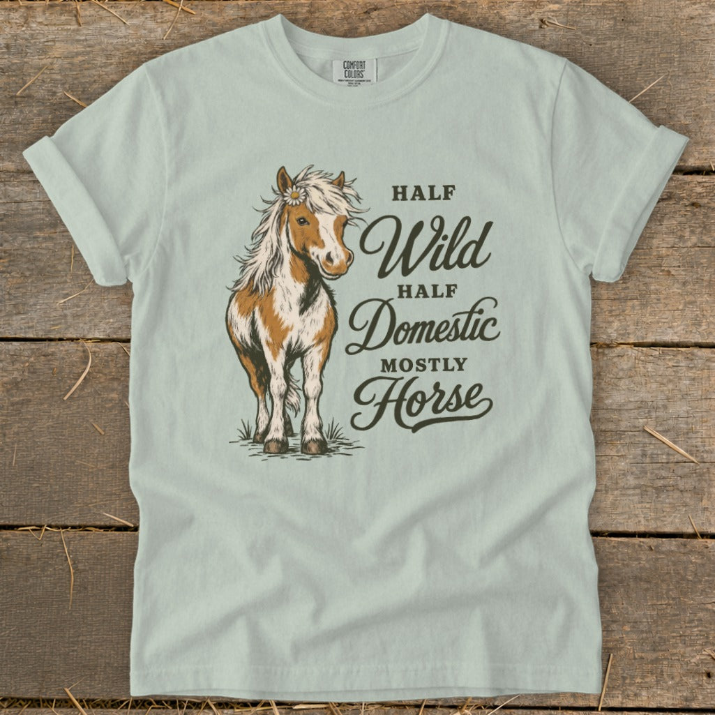 Light blue t-shirt with illustration of a horse and text "Half Wild Half Domestic Mostly Horse".