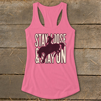 Pink tank top with "Stay Loose & Stay On" text and bucking bronco graphic.